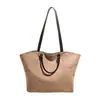 Yozzi 2026 principios de otoño nuevo estilo bolso cubo inspirado en Chanel con correa ancha para el hombro, bolsa de cordón acolchada, bolso de hombro y cruzado de moda