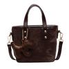 Bolsa feminina de alta qualidade em estilo estrangeiro, nova moda 2025, bolsa de ombro, bolsa de balde super popular e estilosa