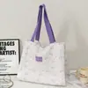 Bolsa de lona suave y linda estilo coreano con patrones en relieve, diseñada para niñas, con un diseño de doble capa y engrosado, gran capacidad y adecuada para la escuela y los desplazamientos.