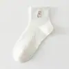Calcetines de mujer hasta la pantorrilla estilo universitario japonés, oso de dibujos animados lindo bordado blanco, calcetines de algodón de malla hueca de verano para estudiantes