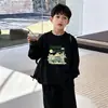 Camiseta de manga larga de algodón puro para niños, versátil top de dibujos animados nuevo para primavera y otoño 2026, camiseta básica para niños, ropa para niños talla mediana y grande