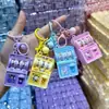 Máquina de Lotería Mini Creativa Transfronteriza Colgante Llavero Dibujos Animados Juguetes Pequeños para Niños Regalos de Premios de Jardín de Infancia Venta al por Mayor