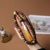Duobao molienda seca material antiguo meteorización pulsera raíz de Bodhi jade blanco estilo Xingshi enrollado suave hombres y mujeres pulsera de cuentas de Buda sosteniendo