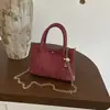 Bolso pequeño transfronterizo simple y elegante para mujer, nuevo bolso de mano casual de verano 2026, bolso tipo cubo con un toque de alta gama, bolso cruzado