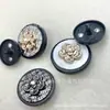 Hebilla de combinación de botones de aleación metálica de alta gama Botón para abrigo de lana Estilo Chanel Flor de moda Accesorios de ropa retro