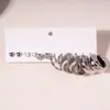 Brincos de Prata Europeus e Americanos Transfronteiriços em Formato de Coração com Agulha Fina e Design Torcido, Brincos Elegantes com Sensação de Luxo e Design de Alto Padrão, Estilo de Nicho