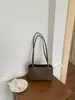 Nova bolsa de axila de nicho de alta qualidade para mulheres no comércio exterior transfronteiriço, bolsa quadrada pequena texturizada, simples e fashion, bolsa de ombro para o dia a dia