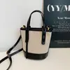 Bolso Cubo Pequeño de Lona Texturizada con Nicho de Color Contrastante para Mujer 2025 Nuevo Bolso Cruzado Satchel de Hombro Casual a la Moda
