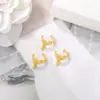 Versión coreana de aretes accesorios de joyería semiacabados fabricantes de materiales aretes de hoja metálica al por mayor aretes personalidad Joker