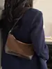 Bolso hobo de mezclilla azul vintage para mujer 2025 nuevo nicho patchwork de un solo hombro color block tipo almohada versión coreana