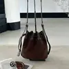 Bolso tipo cubo patchwork de ante 2026 nuevo modelo, bolso cruzado pequeño de ante genuino con cordón, bolso de axila de nicho vintage