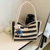 Bolso de mano tejido a rayas de moda transfronterizo 2026 nuevo versátil para el trabajo bolsa grande estilo coreano de gran capacidad para mujer