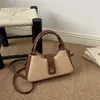 Bolso pequeño cuadrado de moda estilo francés, nuevo modelo 2026, bandolera de versión coreana texturizada, elegante y versátil para ir al trabajo, bolso de axila