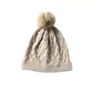 Cachemira Otoño/Invierno 2026 Nuevo Sombrero de Punto Versátil para Mujer con Pompón, Protección para los Oídos, Tejido de Cable, para Maternidad y Posparto, Sombrero Cálido de Punto