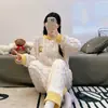 Fábrica fuente pijama nuevo de manga larga de forro polar coral para mujer otoño e invierno franela gruesa invierno conjunto para estar en casa