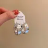 Pendientes Metálicos Geométricos de Ola y Puntos 2026 Nuevo Estilo Popular Pendientes de Alta Gama para Mujeres Estilo Elegante de Socialité