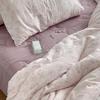 Juego de tres piezas de hilo de algodón de doble capa estilo Ins Una funda de almohada floral de gasa de algodón puro respetuosa con la piel un par de sábanas de color sólido