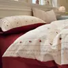 Nuevo juego de cuatro piezas jacquard teñido en hilo de alto peso, estilo simple y fresco, ropa de cama estilo princesa de lujo ligero