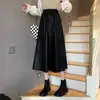Saia estilosa de couro PU preta de comprimento médio para mulheres, outono e inverno, plus size, cintura alta, modeladora e elegante