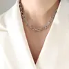Conjunto de joyería de acero y titanio con collar y pulsera con nudo de viento frío exagerado, estilo hip hop europeo y americano, hecho a mano.