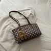 Bolsa feminina estilosa e versátil, nova coleção 2026, moderna e chique, adequada para o dia a dia, bolsa de ombro, design de poá, pode ser carregada sob o braço