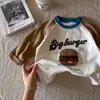 Camiseta de Manga Larga 100% Algodón para Niños 2026 Nueva Prenda Base Raglán para Niños Pequeños y Niños Pequeños Elegante Camiseta de Bloques de Color de Dibujos Animados