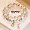 Pulseira com Pingente de Cabaça de Pérola de Vidro de Camada Dupla Design de Nicho Feminino Moda de Luxo Leve Clareamento Presente para Melhor Amigo Pulseira Não