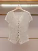Ropa de Mujer de Gama Alta de Shenzhen Nanyou Verano Nuevo Estilo Chic Francés Retro Moda Cuello en V Un Botón Manga Corta Tejido