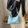 La popular bolsa de mano para dumplings de estilo fresco de este año para mujer, nuevo modelo de otoño 2026, elegante bolso de hombro con lazo, bolso de moda para el antebrazo