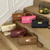 Bolsa de Mão Transfronteiriça para Mulheres 2025 Novo Modelo Pequena Bolsa Quadrada de Comércio Exterior Popular Bolsa Kelly Versátil Bolsa de Ombro Transversal