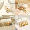 Aogu Europeos y Americanos Chapados en Oro de 18 Quilates Zirconia Goteo de Aceite Ojo del Diablo Acero de Titanio Pendientes para Mujer Set de Pendientes Elegantes de Nicho Nuevo