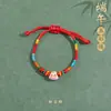 Pulseira de corda colorida zongzi do Festival do Barco-Dragão 2026 novo modelo pulseira trançada artesanal étnica infantil atacado corda vermelha