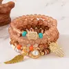 Bestseller transfronterizo: Pulsera con colgante de palma y ala estilo bohemio, pulsera de cuentas con cordón elástico multicapa