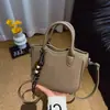 Bolso de Mano Tejido Popular Retro para Mujer 2026 Principios de Otoño Diseño de Nicho Versátil Tacto de Alta Gama Bolso de Hombro Cruzado
