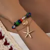 Colar Feminino Estilo Resort de Praia Boêmio com Pingente Redondo de Estrela-do-Mar em Liga Metálica, Strass Colorido e Contas de Pérola