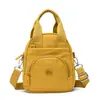 Bolso Pequeño Cruzado para Mujer 2026 Nuevo Estilo Bolso de Mano Mini Cruzado de Moda Compacto Tela de Nylon Bolso de Hombro para Teléfono para Mujer