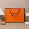 Saco de presente grande de fábrica saco de presente de roupas saco de papelão branco laranja saco de embalagem de bolsa simples atacado