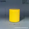 El fabricante suministra botellas amarillas de boca ancha de 300 ML con 75 hilos, hechas de material HDPE, adecuadas para alimento de pescado en polvo.