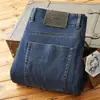 2025 Novo Verão Fino de Alta Qualidade Elástico em Quatro Lados Cores Primárias Calças Compridas Casuais Masculinas Jeans Casuais Retos