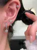 Exquisito conjunto de pendientes colgantes de trébol de cuatro hojas con diamantes brillantes, pendientes de nicho de lujo ligero, elegantes pendientes de aro y ear cuffs de circonita
