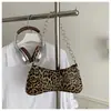 Bolso de mano para mujer de estilo europeo y americano con estampado de leopardo para comercio exterior, nuevo diseño de nicho de moda 2026, bolso simple de hombro y axila