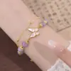 Pulsera de mariposa de amatista sintética para mujer, diseño de nicho de lujo ligero ins, nuevo brazalete de cristal de alta gama, regalo para novias