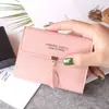 Nueva cartera pequeña femenina corta estudiante moda coreana pequeña fresca hoja tres pliegues hebilla monedero tarjetero mayoreo
