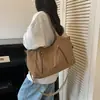 Nova Bolsa de Lona Outono 2026 Estilo Coreano Retrô Cor Sólida Grande Capacidade Bolsa Tote para Trabalho Deslocamento Bolsa de Ombro Casual