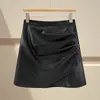 Falda irregular de piel sintética marrón para mujer, estilo otoño e invierno, combinada con botas, talla grande, estilo Miu, minifalda de línea A ajustada a la cadera