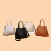 Bolso de Mano de Cuero Suave Más Vendido en Comercio Exterior para Mujer Modelo Nuevo 2026 Bolso de Hombro Cruzado de Tres Capas de Gran Capacidad Simple y Elegante