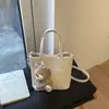 Bolsa Balde de Mão com Design de Nicho Estilo Coreano para Mulheres Nova Moda Primavera 2026 Bolsa de Ombro Transversal Simples e Elegante