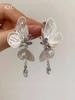 Pendientes de mariposa de plata con forma de media luna para mujer, estilo retro francés, diseño único, ligeros, lujosos y de alta gama.