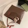 Bolso Tote de Cuero Encerado de Gran Capacidad a la Moda 2026 Primavera Nuevo Elegante y Único Retro Bolso de Hombro/Axila