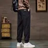 Pantalones jogger de pana forrados y engrosados de venta caliente transfronterizos para hombre, pantalones holgados y versátiles, pantalones cálidos de marca de moda para otoño e invierno